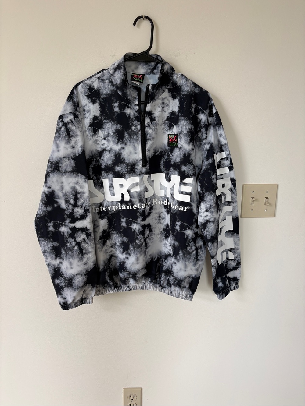 surf style Black Tag Jacket Label with Neon Pink and Green Logo